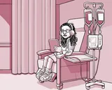 Nia sentada en una silla en el centro de infusión.