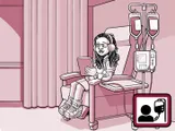 Nia sentada en una silla en el centro de infusión.