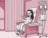 Nia sentada en una silla en el centro de infusión.