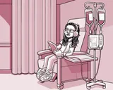 Nia sentada en una silla en el centro de infusión.