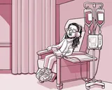 Nia sentada en una silla en el centro de infusión.
