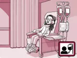 Nia sentada en una silla en el centro de infusión.