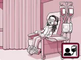 Nia sentada en una silla en el centro de infusión.