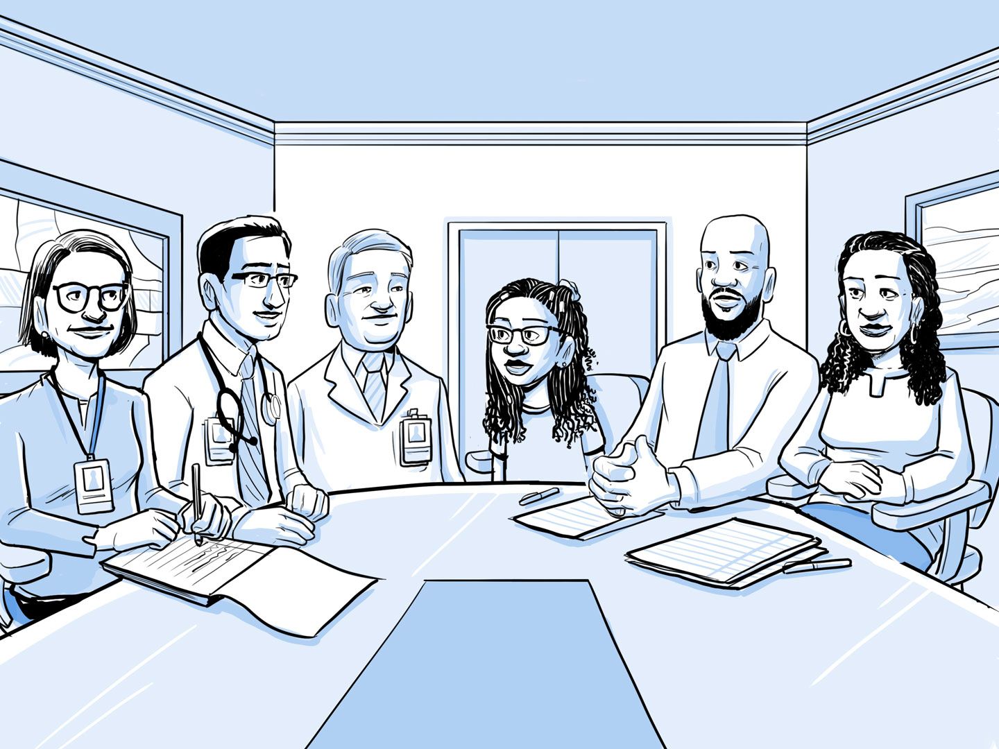 En una sala de reuniones, el equipo médico habla con Nia y su familia.