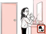 Nia tomando el medicamento en su hogar.
