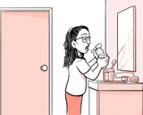 Nia tomando el medicamento en su hogar.