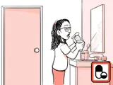 Nia tomando el medicamento en su hogar.